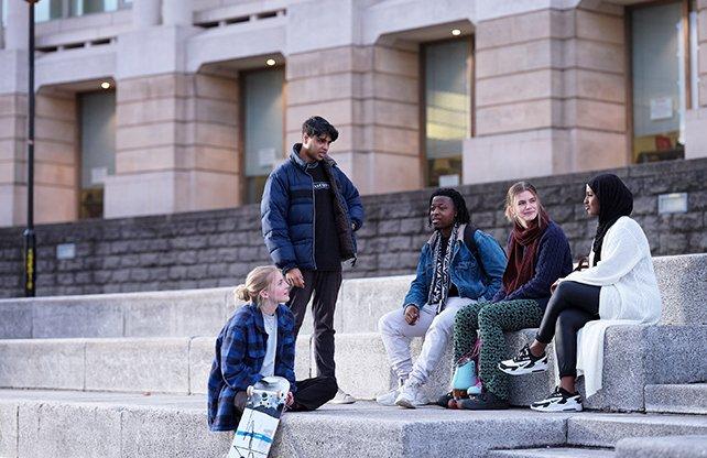 students-on-steps-about-us-photo-slice