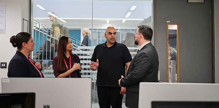 Jisc and Aston Manor staff hold a group discussion.