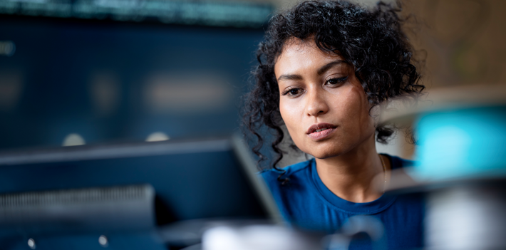 A female software engineer on software project development to analyzing and ensuring reliability in a tech business office