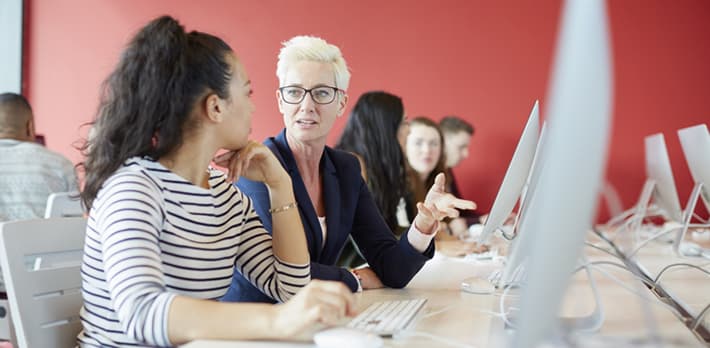 Student and tutor working at a computer