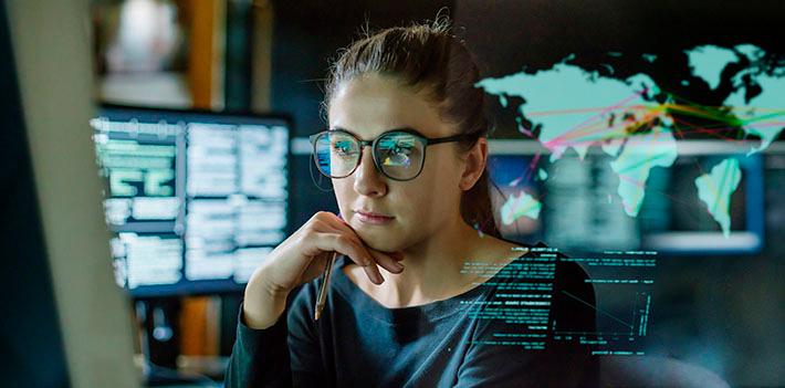 Female researcher looking at a computer screen.